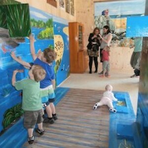 Makarewa children enjoy the interactive tunnel in the Nature Centre