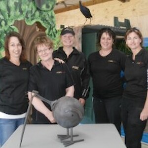 SBS staff with &quot;kiwi saver&quot; artwork by Trevor Huggins