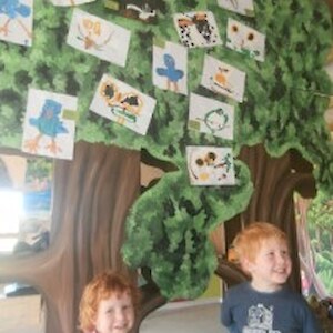 Dylan and Maya look at the bird paintings