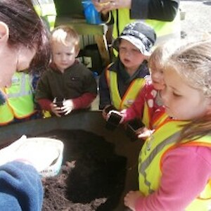 Makarewa learning to pot up native plants