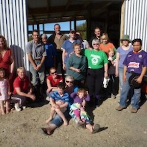 Volunteers Easter Friday in front of new education centre building