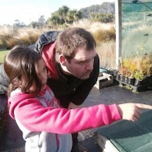Teacher Simon learning about plants 