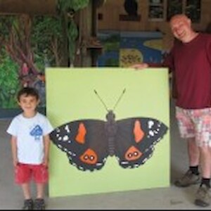 Brian Patrick and son admire the new butterfly artwork