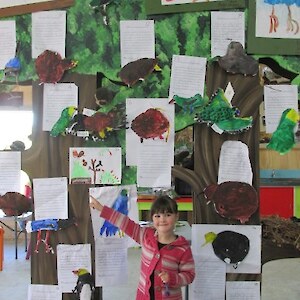 Moana shows some of the bird paintings on display